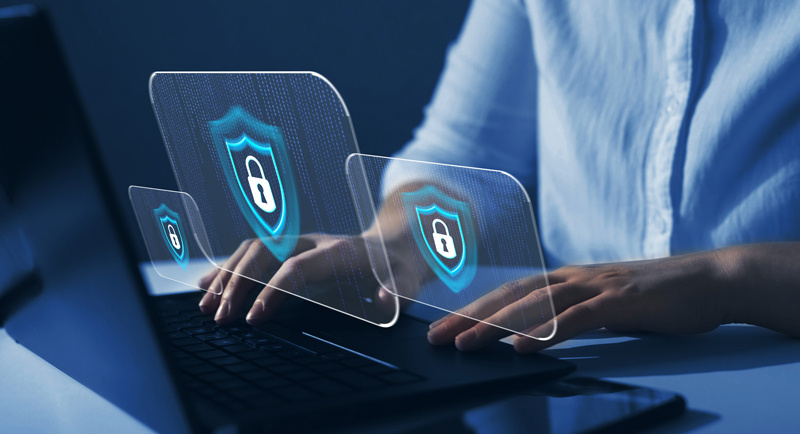Hands on keyboard with security symbols Hands on keyboard with security symbols